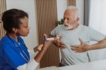 Senior man visiting his doctor concept